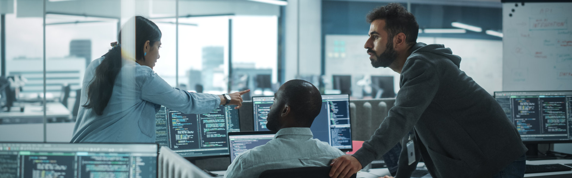 computer programmers talking in the office